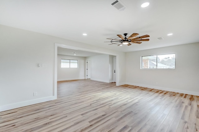 spare room with ceiling fan and light hardwood / wood-style floors