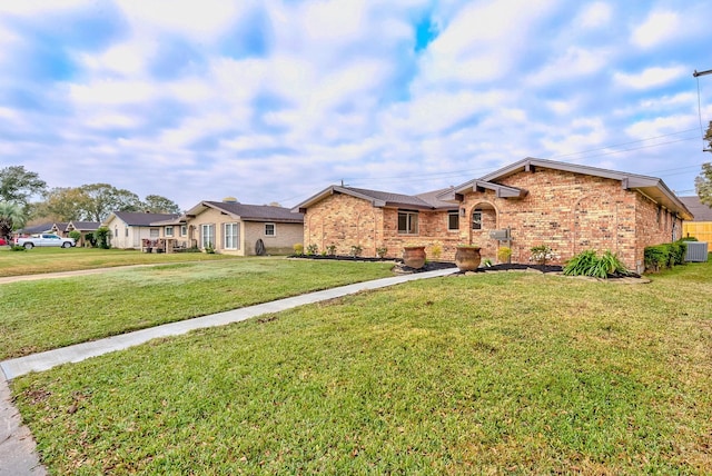 ranch-style house featuring a front lawn