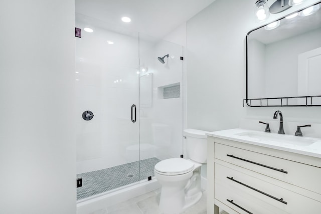 bathroom featuring tile patterned floors, vanity, an enclosed shower, and toilet