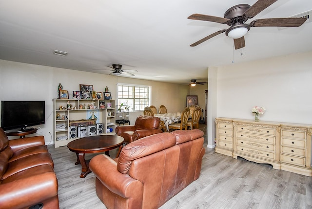 living room with light hardwood / wood-style floors