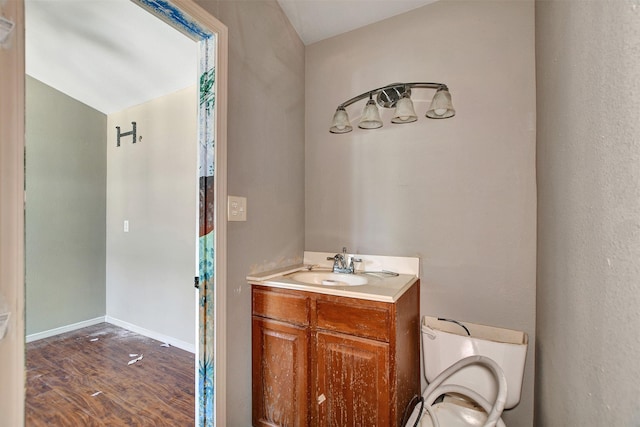 bathroom featuring vanity and hardwood / wood-style flooring