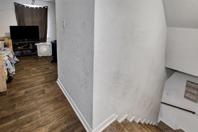 staircase with hardwood / wood-style flooring