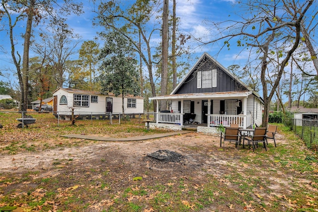 back of house featuring covered porch