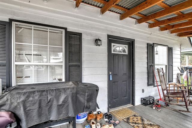 doorway to property with a porch