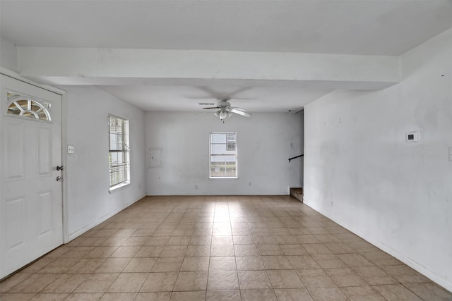 entrance foyer with baseboards and ceiling fan