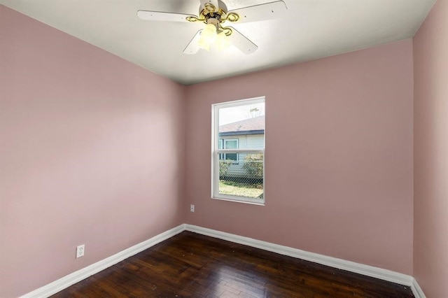 unfurnished room featuring dark hardwood / wood-style floors and ceiling fan