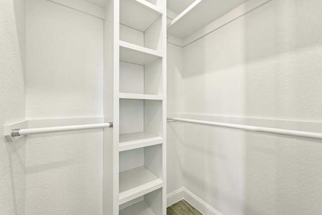 walk in closet featuring hardwood / wood-style flooring