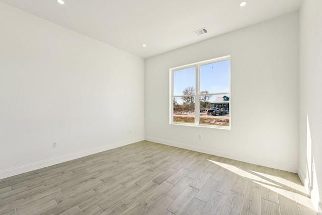 unfurnished room featuring light hardwood / wood-style flooring