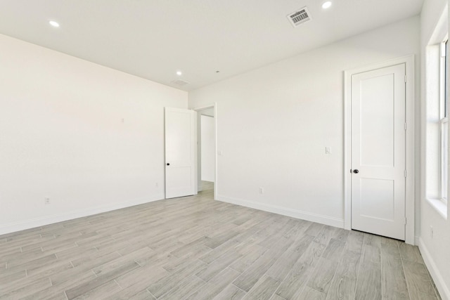 unfurnished room featuring light hardwood / wood-style flooring