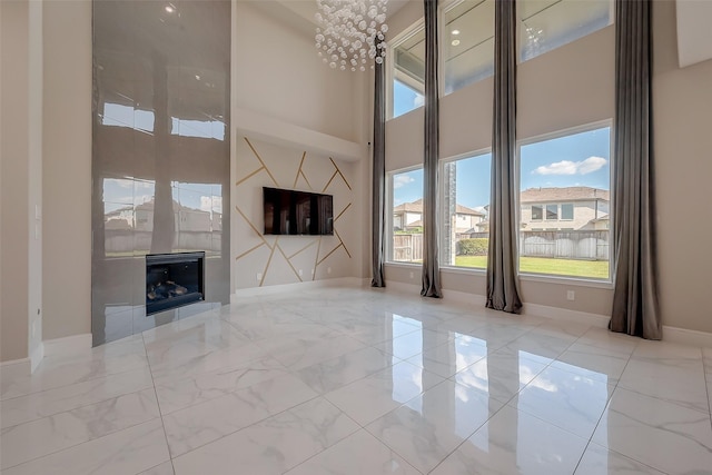 unfurnished living room featuring a fireplace