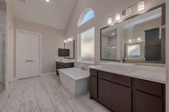 bathroom with vanity, independent shower and bath, and high vaulted ceiling