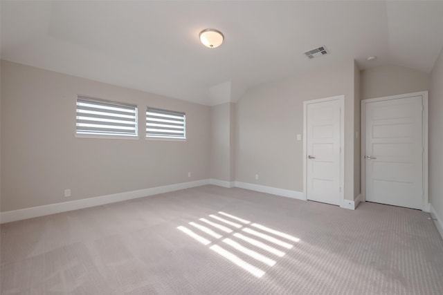 unfurnished bedroom featuring light carpet