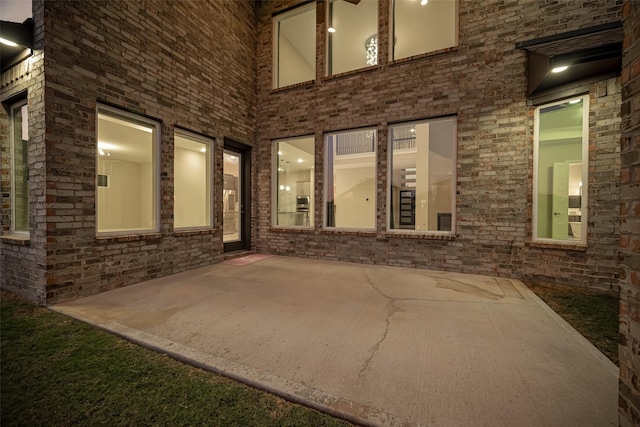 entrance to property featuring a patio area