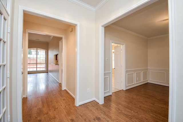 corridor featuring hardwood / wood-style floors and crown molding