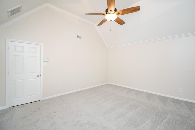 unfurnished room featuring ornamental molding, lofted ceiling, light carpet, and ceiling fan