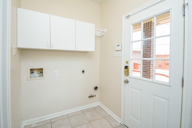 laundry room featuring hookup for a washing machine, a healthy amount of sunlight, hookup for an electric dryer, and cabinets