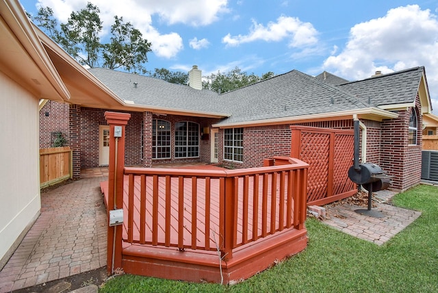 deck with central AC unit and grilling area