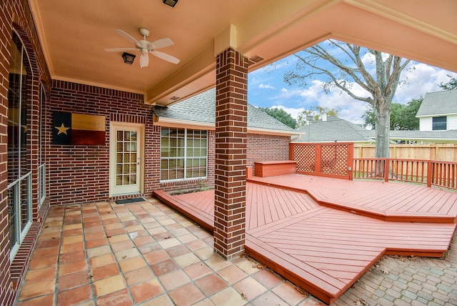 wooden terrace with a patio and ceiling fan