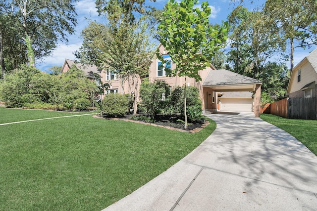 view of front of house featuring a front lawn and a garage