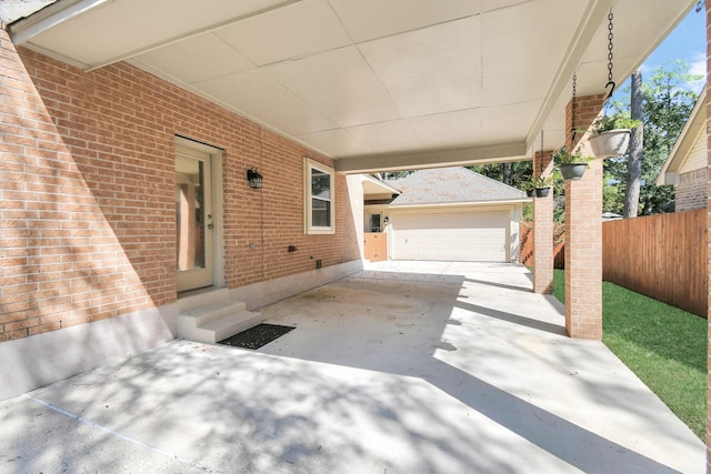 view of patio / terrace featuring a garage