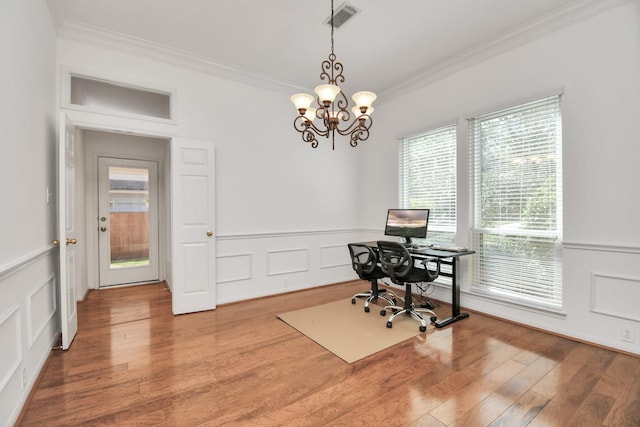 office space with crown molding, a chandelier, and wood-type flooring