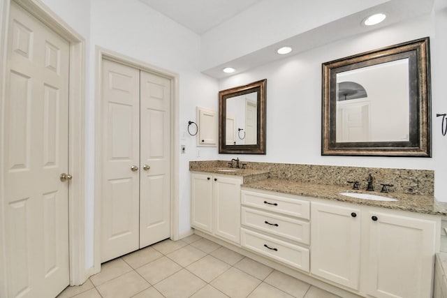 bathroom with tile patterned flooring and vanity