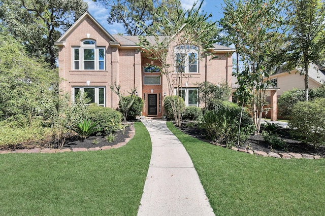 view of front of home with a front lawn