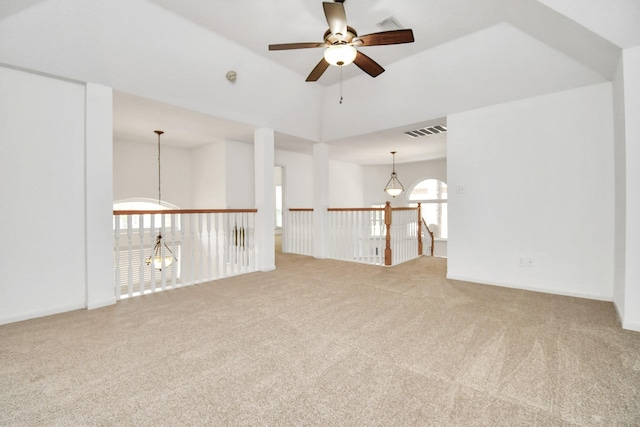 unfurnished room featuring carpet flooring, ceiling fan, and lofted ceiling