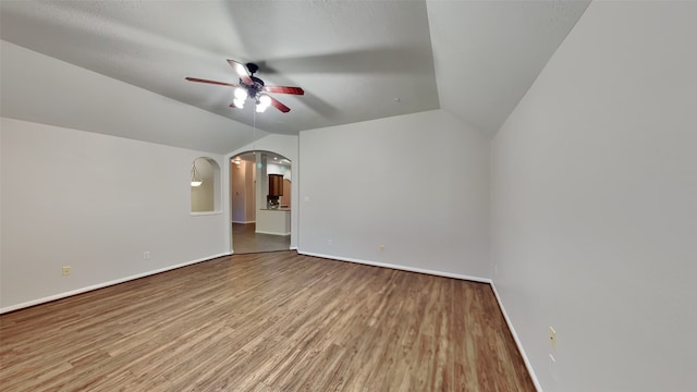 interior space featuring hardwood / wood-style floors, ceiling fan, and lofted ceiling