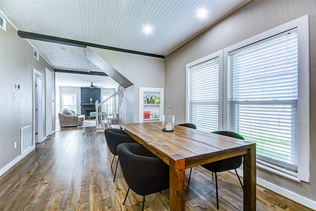 dining area with dark hardwood / wood-style flooring, plenty of natural light, ceiling fan, and wood ceiling