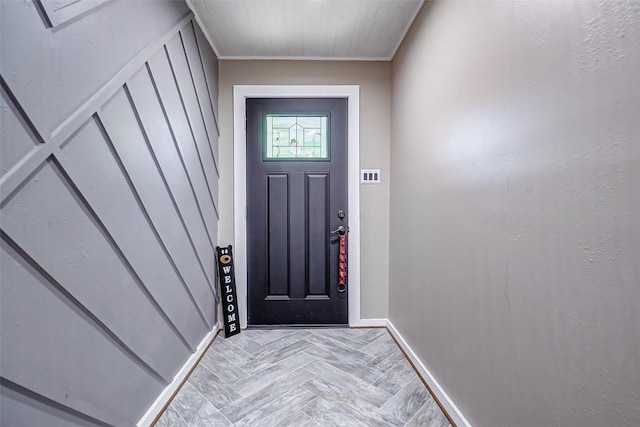 interior space with ornamental molding and light parquet flooring