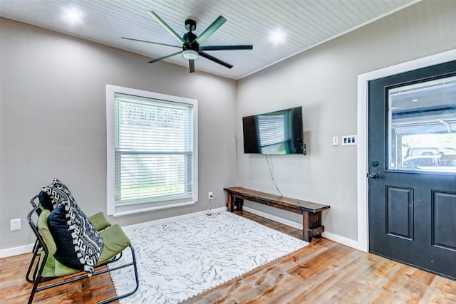 interior space with ceiling fan, hardwood / wood-style floors, and wood ceiling