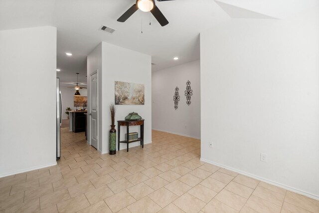 unfurnished room with ceiling fan and vaulted ceiling