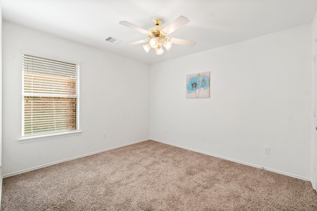 unfurnished room with carpet floors and ceiling fan