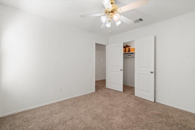 unfurnished bedroom with carpet flooring, a closet, and ceiling fan