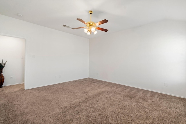 unfurnished room with ceiling fan and carpet