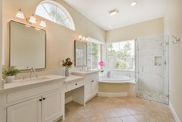 bathroom with tile patterned flooring, shower with separate bathtub, and vanity