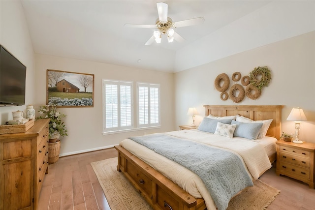 bedroom with light hardwood / wood-style floors and ceiling fan