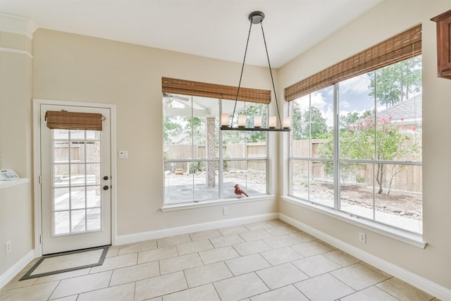 unfurnished dining area with light tile patterned flooring