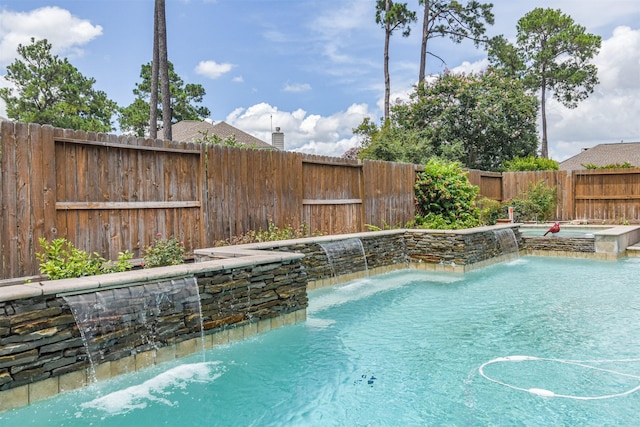 view of swimming pool featuring pool water feature