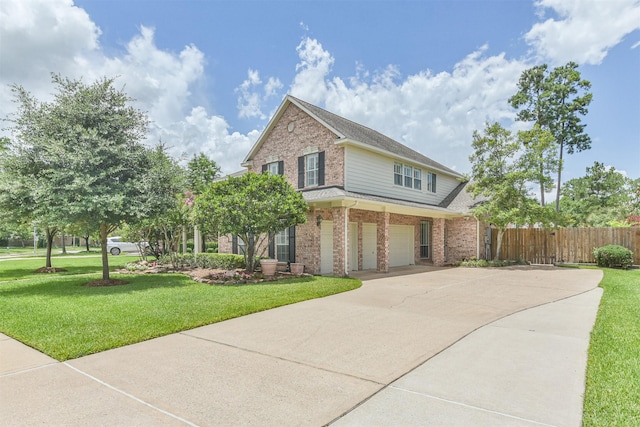 view of front facade featuring a front yard and a garage