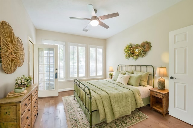 bedroom featuring light hardwood / wood-style floors and ceiling fan