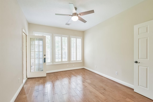 spare room with ceiling fan and light hardwood / wood-style floors