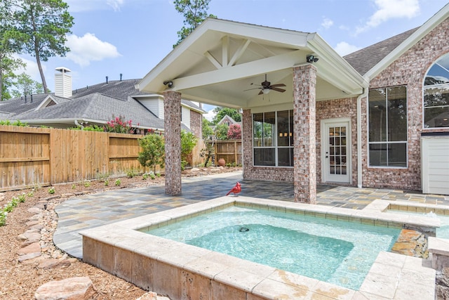 view of pool featuring ceiling fan and a patio area