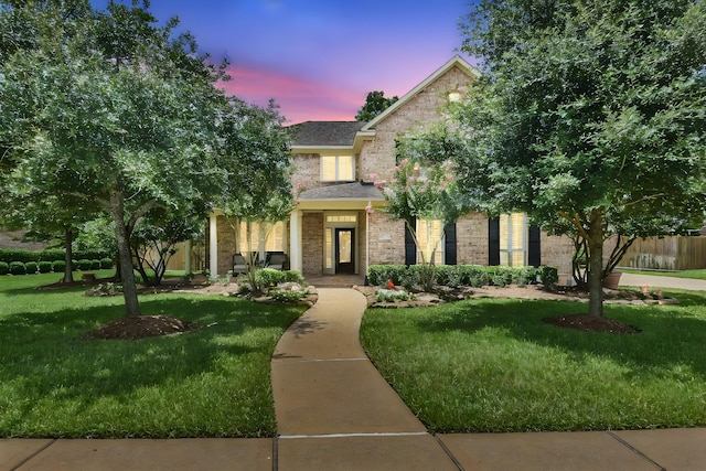 view of front of property with a lawn