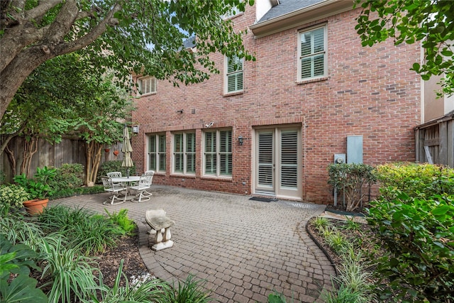 back of property featuring a patio area