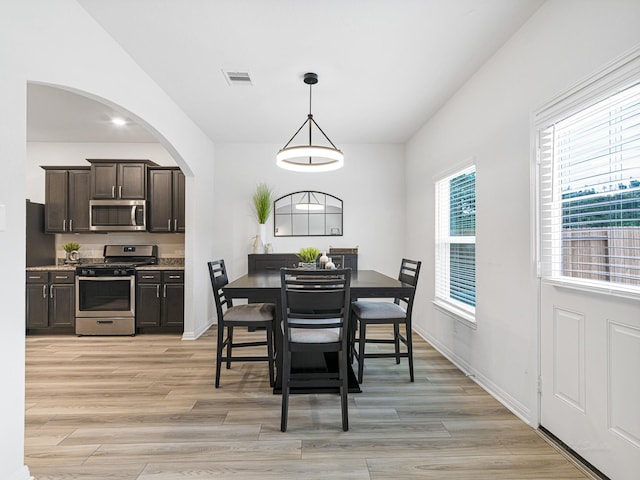 dining area with light hardwood / wood-style floors