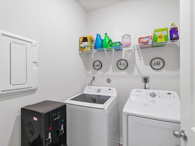 laundry room featuring washing machine and clothes dryer