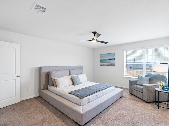 bedroom featuring ceiling fan and carpet floors