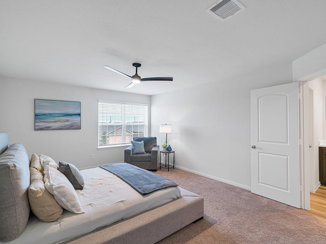 carpeted bedroom featuring ceiling fan